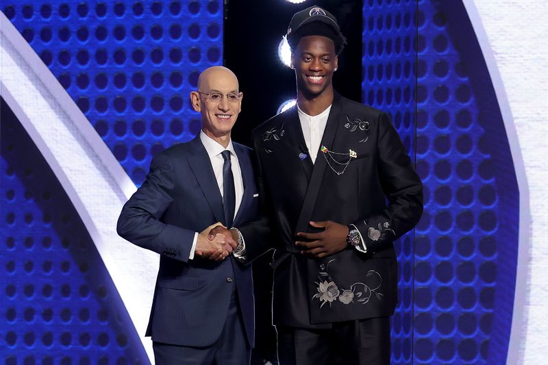 Jun 23, 2026; New York, NY, USA; AJ Dybantsa poses for photos with NBA commissioner Adam Silver after being selected first overall by the Washington Wizards during the 2026 NBA Draft at Barclays Center. Mandatory Credit: Brad Penner-Imagn Images