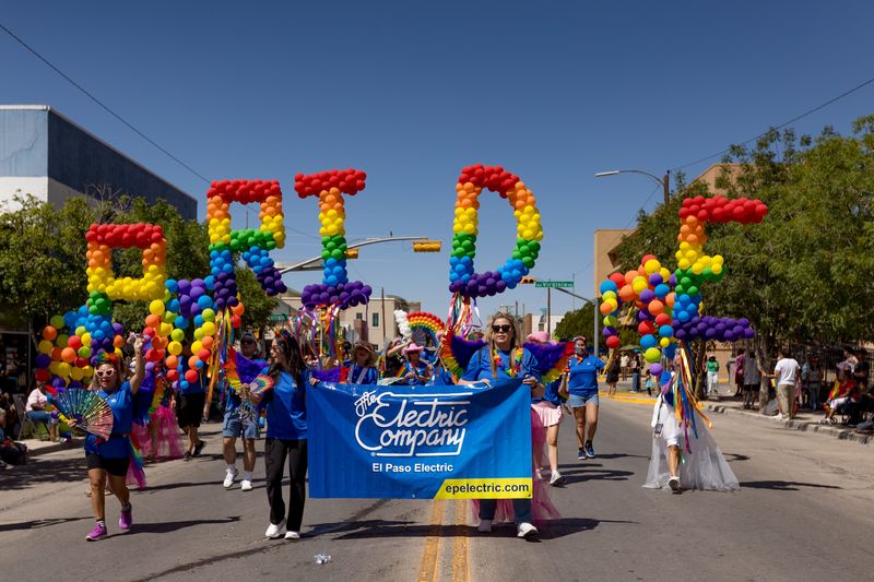 Rainbow balloons spelling out “PRIDE” are carried during the 2026 Sun City Pride Parade in Downtown El Paso on Saturday, June 27, 2026.