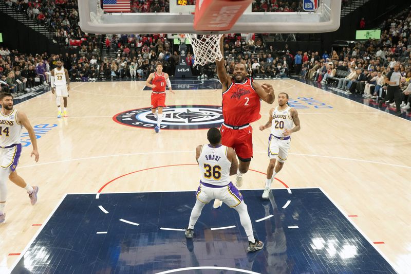 Dec 20, 2025; Inglewood, California, USA; LA Clippers forward Kawhi Leonard (2) collides with Los Angeles Lakers guard Marcus Smart (36) in the first half at Intuit Dome. Mandatory Credit: Kirby Lee-Imagn Images