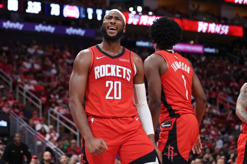 Oct 24, 2025; Houston, Texas, USA; Houston Rockets guard Josh Okogie (20) reacts after a play during the third quarter against the Detroit Pistons at Toyota Center. Mandatory Credit: Troy Taormina-Imagn Images