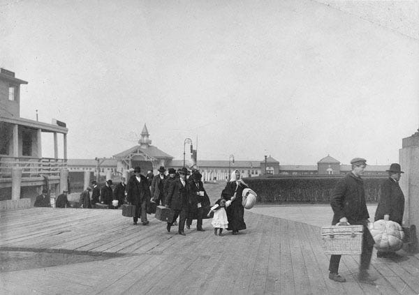 Immigrants arrive at Ellis Island, about 1910.