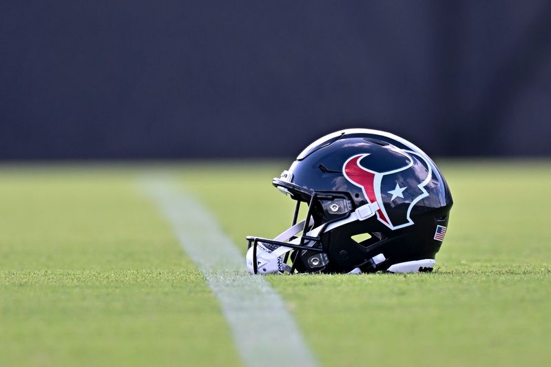 Jun 10, 2026; Houston, Texas, USA; A detail view of a Houston Texans helmet on the field during the team’s minicamp at Houston Methodist Training Center. Mandatory Credit: Maria Lysaker-Imagn Images