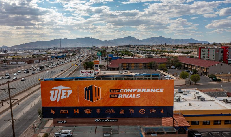 A billboard announcing UTEP's move to the Mountain West Conference stands near Interstate 10 and Viscount Boulevard on Monday, June 29, 2026, in El Paso, Texas. UTEP officially joined the Mountain West on July 1 after 22 years in Conference USA, returning to a conference footprint that includes longtime regional rivals and aligns more closely with the university's western roots.