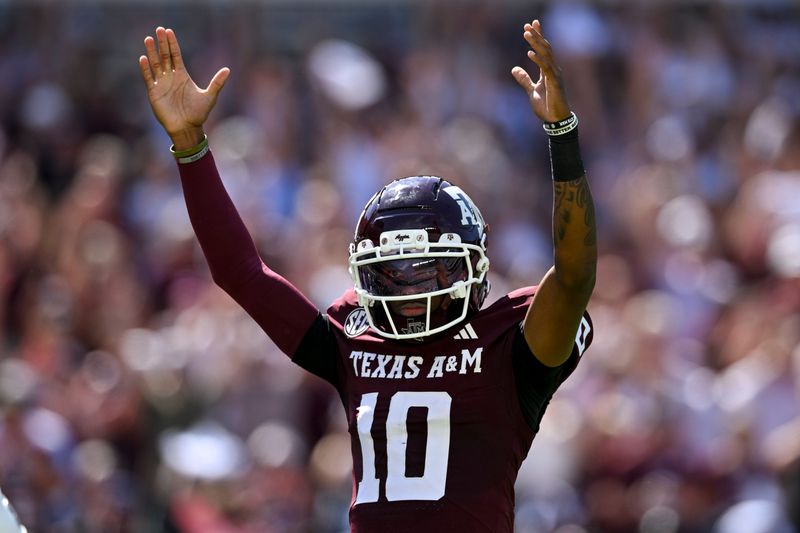 Sep 27, 2025; College Station, Texas, USA; Texas A&M Aggies quarterback Marcel Reed (10) reacts after throwing a touchdown pass during the first quarter against the Auburn Tigers at Kyle Field. Mandatory Credit: Maria Lysaker-Imagn Images