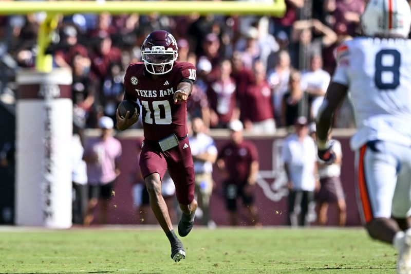 Sep 27, 2025; College Station, Texas, USA; Texas A&M Aggies quarterback Marcel Reed (10) runs the ball during the second quarter against the Auburn Tigers at Kyle Field. Mandatory Credit: Maria Lysaker-Imagn Images