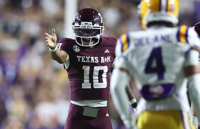 Oct 25, 2025; Baton Rouge, Louisiana, USA; Texas A&M Aggies quarterback Marcel Reed (10) celebrates after a first down during the first half against the Louisiana State Tigers at Tiger Stadium. Mandatory Credit: Stephen Lew-Imagn Images