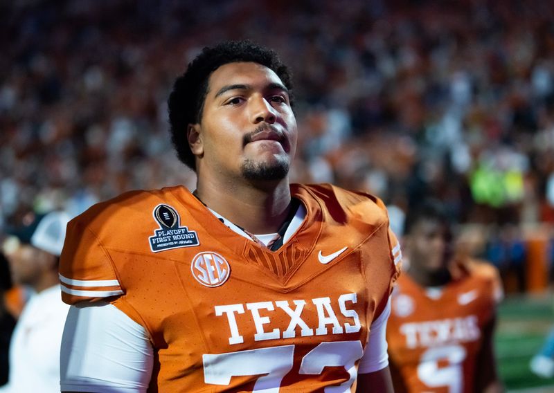 Dec 21, 2024; Austin, Texas, USA; Texas Longhorns offensive lineman Brandon Baker (73) against the Clemson Tigers during the CFP National playoff first round at Darrell K Royal-Texas Memorial Stadium. Mandatory Credit: Mark J. Rebilas-Imagn Images