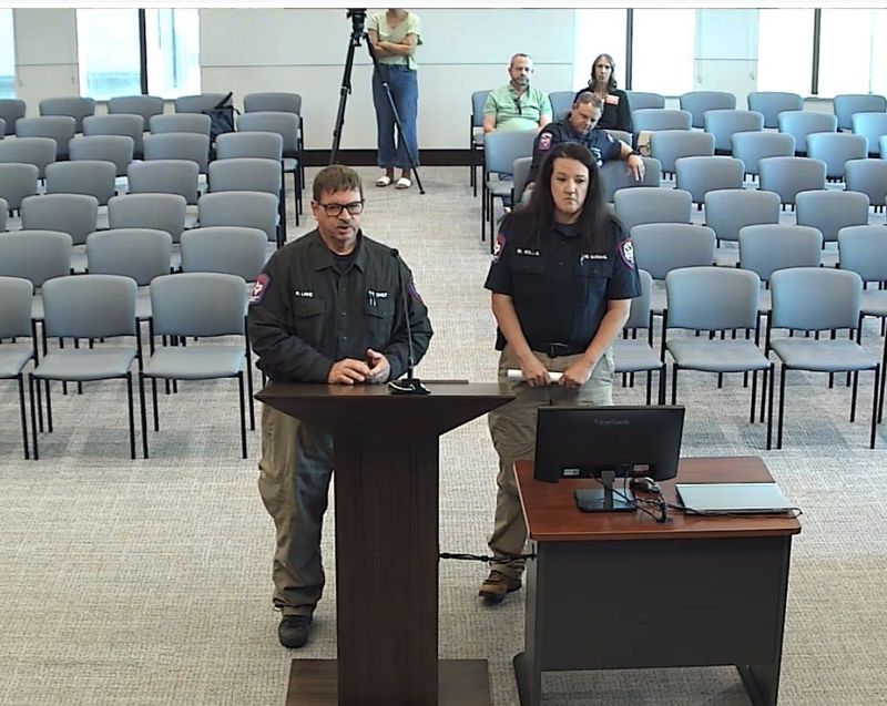 Potter County Fire Chief Richard Lake stands with Potter County Fire Marshal Mary Willis at the special Potter County Commissioners' Court meeting held Tuesday morning, July 7 to extend the local disaster declaration and burn ban for 90 more days, due to extreme drought conditions.