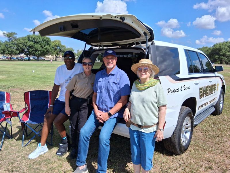 Members of the Potter County Sheriff's Office, along with City Councilman Tim Reid and Ann Shoen, a longtine Pleasant Valley resident whose grandmother settled in Pleasant Valley, enjoyed the first Community Picnic held Saturday, July 18, at Pleasant Valley Park.