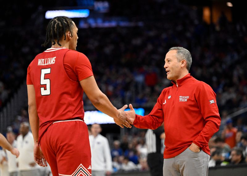 Mar 29, 2025; San Francisco, CA, USA; Texas Tech Red Raiders forward Darrion Williams (5) high-fives head coach Grant McCasland during the second half against the Florida Gators during the West Regional final of the 2025 NCAA tournament at Chase Center. Mandatory Credit: Eakin Howard-Imagn Images