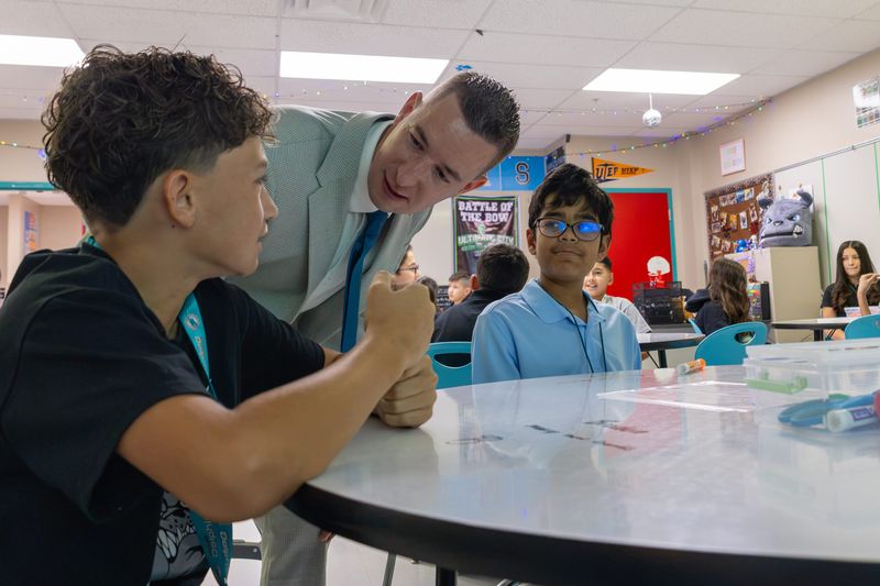Principal Patrick Gailey welcomes students and families to Brown Middle School on Monday, Aug. 3, during the school’s first day of the 2026–27 school year.