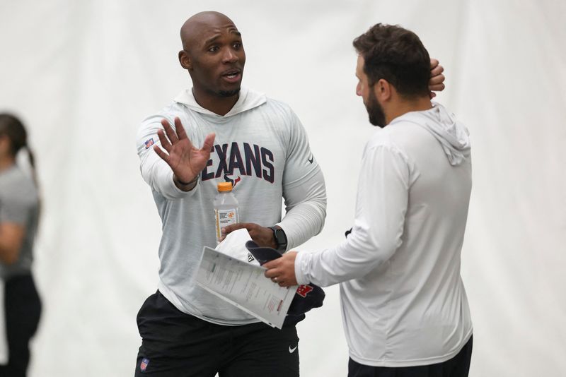 Jul 31, 2026; Houston, TX, USA; Houston Texans head coach DeMeco Ryans talks with offensive coordinator Nick Caley during training camp at Houston Methodist Training Center. Mandatory Credit: Troy Taormina-Imagn Images