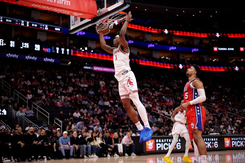 Apr 9, 2026; Houston, Texas, USA; Houston Rockets guard Amen Thompson (1) dunks the ball against Philadelphia 76ers guard Quentin Grimes (5) during the first quarter at Toyota Center. Mandatory Credit: Erik Williams-Imagn Images