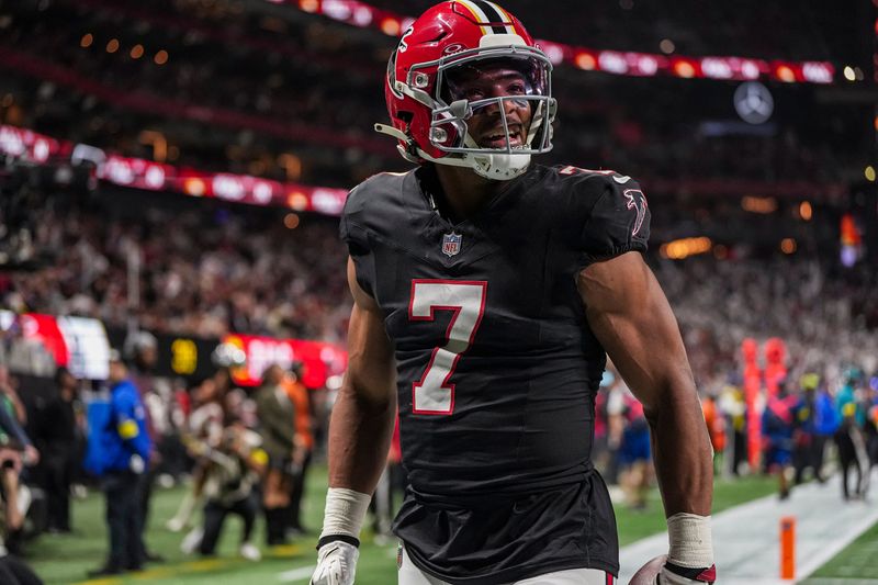 Dec 29, 2025; Atlanta, Georgia, USA; Atlanta Falcons running back Bijan Robinson (7) reacts after catching a touchdown pass against the Los Angeles Rams during the first quarter at Mercedes-Benz Stadium. Mandatory Credit: Dale Zanine-Imagn Images