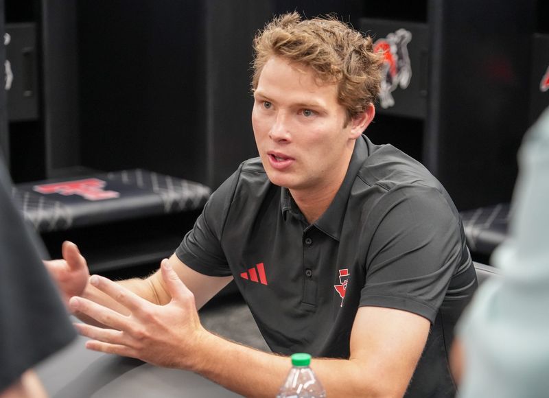 Texas Tech's Will Karoll conducts an interview during the football team's local media day,Tuesday, Aug. 4, 2026, at Galaxy Stadium.