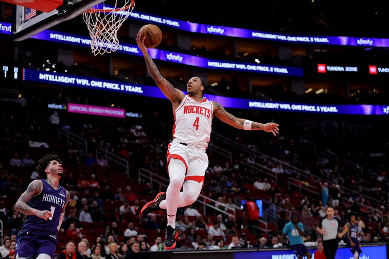 Feb 5, 2026; Houston, Texas, USA; Houston Rockets guard JD Davison (4) shoots against the Charlotte Hornets during the fourth quarter at Toyota Center. Mandatory Credit: Erik Williams-Imagn Images