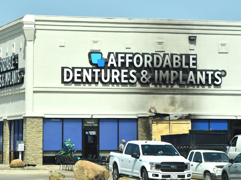 Damage can be seen at the Affordable Dentures and Implants business, at 3916 Call Field Road, Suite 600, after an early morning blaze on Thursday, Aug. 6, 2026, in Wichita Falls.