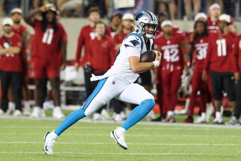 Aug 6, 2026; Canton, Ohio, USA; Carolina Panthers quarterback Haynes King (16) runs the ball during the game against the Arizona Cardinals at Tom Benson Hall of Fame Stadium. Mandatory Credit: Charles LeClaire-Imagn Images
