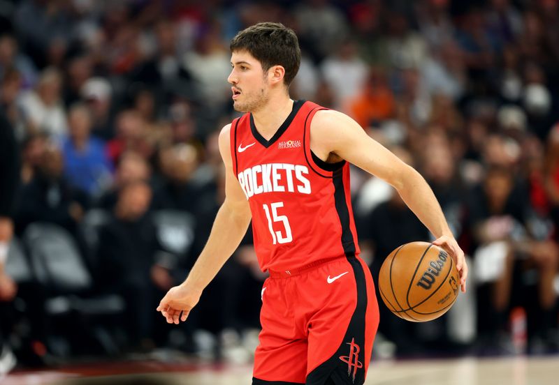Apr 7, 2026; Phoenix, Arizona, USA; Houston Rockets guard Reed Sheppard (15) against the Phoenix Suns at Mortgage Matchup Center. Mandatory Credit: Mark J. Rebilas-Imagn Images
