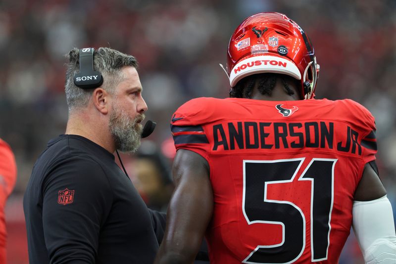 Dec 21, 2025; Houston, Texas, USA; Houston Texans defensive coordingaor Matt Burke talks with defensive end Will Anderson Jr. (51) during the game against the Las Vegas Raiders at NRG Stadium. Mandatory Credit: Troy Taormina-Imagn Images