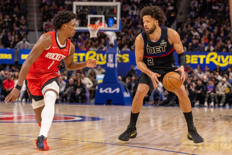 Jan 23, 2026; Detroit, Michigan, USA; Houston Rockets guard Amen Thompson (1) defends against Detroit Pistons guard Cade Cunningham (2) during the second half at Little Caesars Arena. Mandatory Credit: David Reginek-Imagn Images