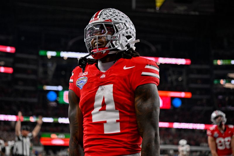 Dec 31, 2025; Arlington, TX, USA; Ohio State Buckeyes wide receiver Jeremiah Smith (4) celebrates after he runs for a touchdown during the 2025 Cotton Bowl and quarterfinal game of the College Football Playoff at AT&T Stadium. Mandatory Credit: Jerome Miron-Imagn Images