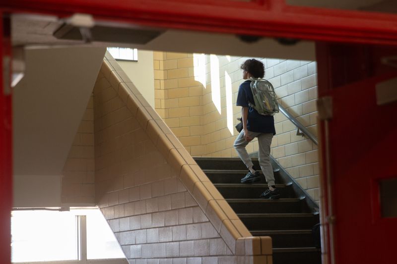 A student heads up a stairwell on the first day of school at Ray High School in Corpus Christi, Texas, on Aug. 11, 2026.