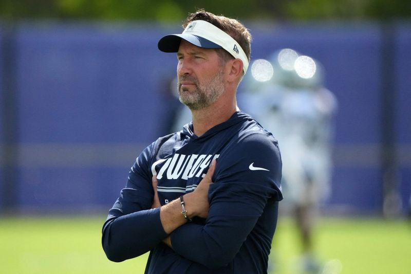 Aug 11, 2026; Woodland Hills, CA, USA; Dallas Cowboys head coach Brian Schottenheimer reacts during a joint practice against the Los Angeles Rams at the Rams Practice Facility. Mandatory Credit: Kirby Lee-Imagn Images