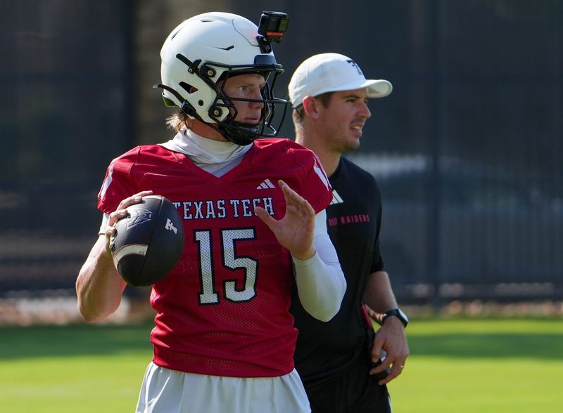 Texas Tech's Will Hammond prepares to through as offensive coordinator Mack Leftwich looks on during football practice, Thursday, Aug. 6, 2026, at the Womble Football Center.