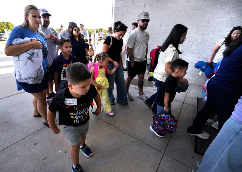 Students and their parents enter Wylie East Elementary School on the first day of school Wednesday, Aug. 12, 2026. Abilene ISD schools will start their school year on Wednesday Aug. 19.