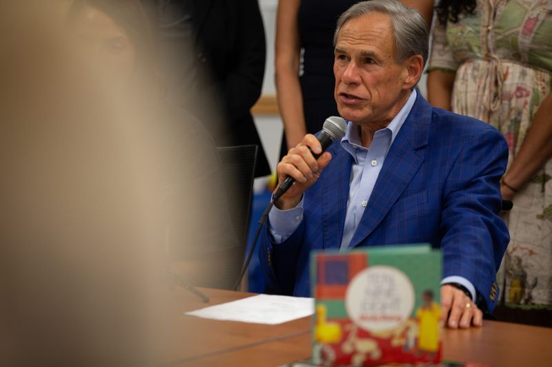 Gov. Greg Abbott answers questions from media at Del Mar College in Corpus Christi on Aug. 13.