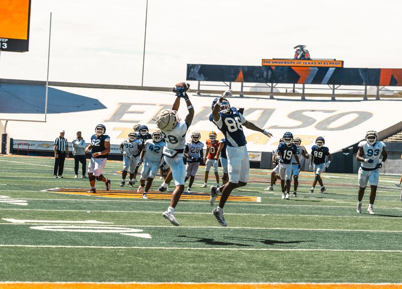 UTEP safety Tyler Hockett ends Saturday’s Sun Bowl scrimmage with an interception against tight end Benny Okwura.