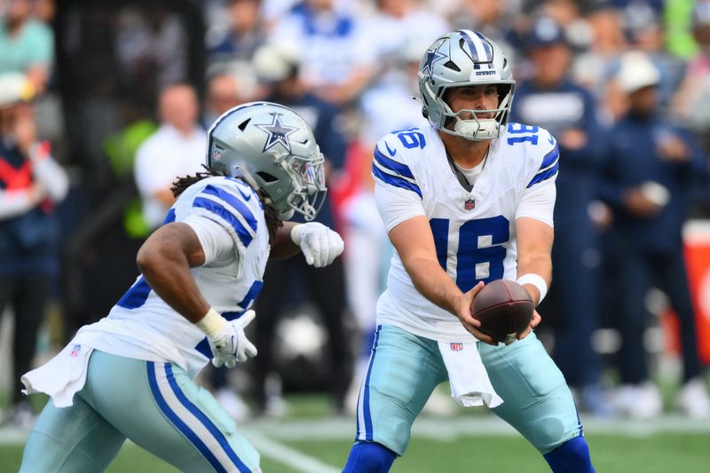 Aug 15, 2026; Seattle, Washington, USA; Dallas Cowboys quarterback Sam Howell (16) hands the ball off to Dallas Cowboys running back Jaydon Blue (23) during the first half at Lumen Field. Mandatory Credit: Steven Bisig-Imagn Images