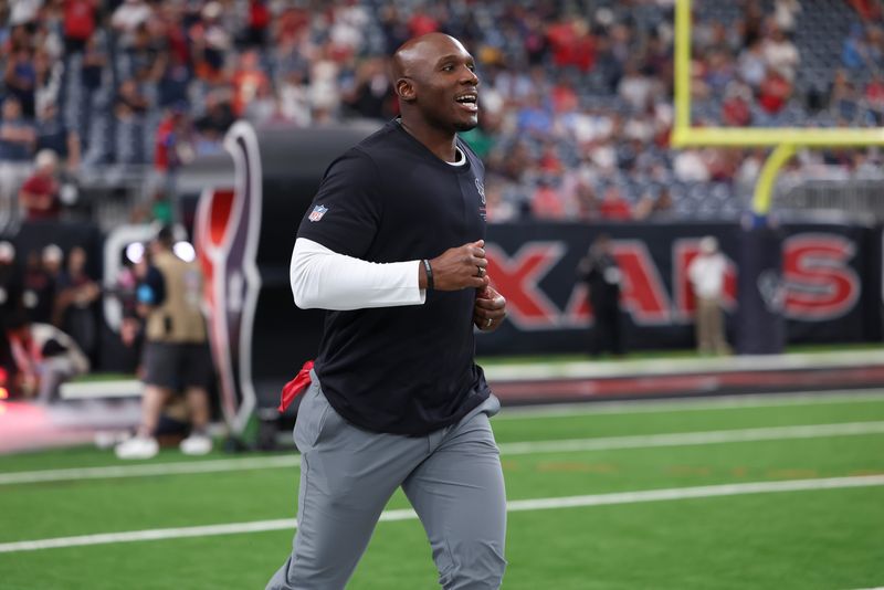 Aug 13, 2026; Houston, Texas, USA;  Houston Texans head coach DeMeco Ryans jogs onto the field before the game against the Los Angeles Chargers at Reliant Stadium. Mandatory Credit: Troy Taormina-Imagn Images