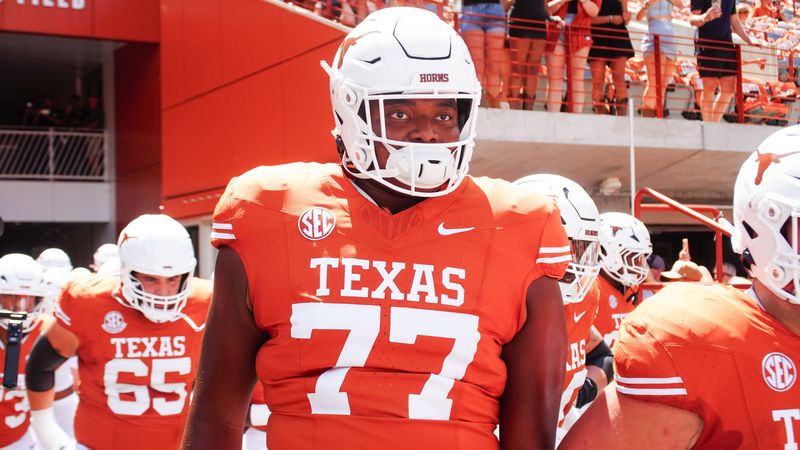 Aug 31, 2024; Austin, Texas, USA; Texas Longhorns lineman Andre Cojoe (77) runs out onto the field before a game at Darrell K Royal-Texas Memorial Stadium. Mandatory Credit: Aaron Meullion-USA TODAY Sports