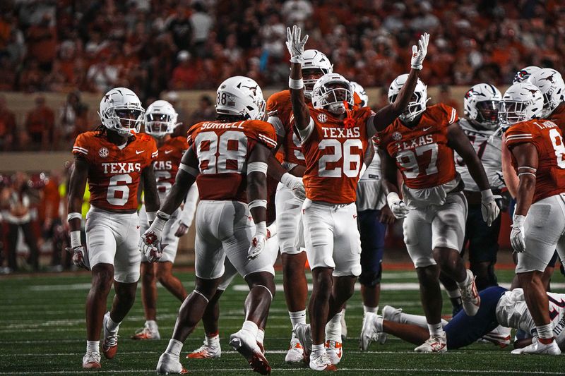 Sep 14, 2024; Austin, Texas, USA; Texas Longhorns linebacker Ty'Anthony Smith (26) celebrates a defensive stop in the game against UTSA at Darrell K Royal–Texas Memorial Stadium. Mandatory Credit: Aaron E. Martinez/USA TODAY Network via Imagn Images
