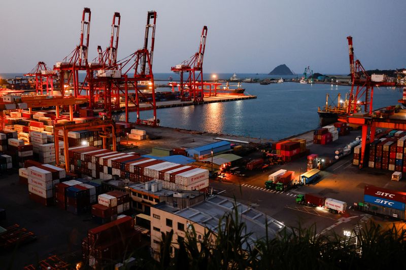 FILE PHOTO: Containers and equipment are seen at the Port of Keelung, Taiwan April 3, 2025. REUTERS/Ann Wang/File Photo