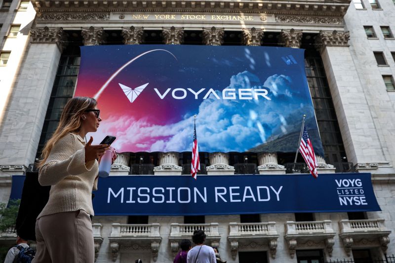 A Voyager Technologies banner hangs on the front of the New York Stock Exchange (NYSE) to celebrate the company’s IPOin New York City, U.S., June 11, 2025.  REUTERS/Brendan McDermid