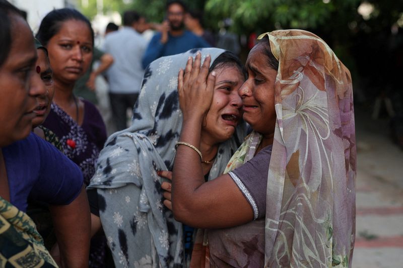 A family member cries upon hearing the news of her brother who died when the Air India Boeing 787 Dreamliner plane crashed in Ahmedabad, India, June 12, 2025. REUTERS/Amit Dave