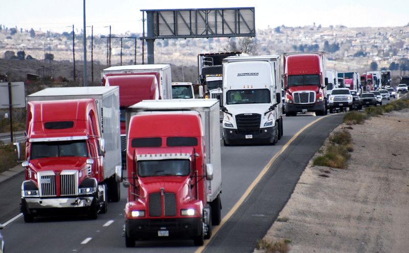 FILE PHOTO: A large convoy heads east bound on the 40 freeway, Daggett, California, U.S. February 23, 2022. REUTERS/Gene Blevins/File Photo