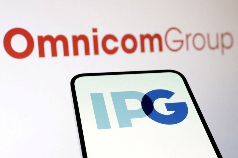 FILE PHOTO: Omnicom Group and Interpublic Group logos are seen in this illustration taken December 9, 2024. REUTERS/Dado Ruvic/Illustration/File Photo
