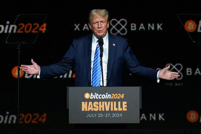 FILE PHOTO: Republican presidential nominee and former U.S. President Donald Trump gestures at the Bitcoin 2024 event in Nashville, Tennessee, U.S., July 27, 2024. REUTERS/Kevin Wurm/File Photo