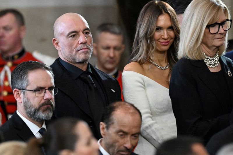 FILE PHOTO: US media personality Joe Rogan stands for a benediction after President Donald Trump was sworn in as the 47th US President in the US Capitol Rotunda in Washington, DC, on January 20, 2025.     SAUL LOEB/Pool via REUTERS/File Photo