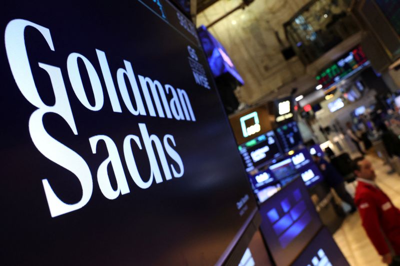 FILE PHOTO: A screen displays the company logo for Goldman Sachs on the floor at the New York Stock Exchange (NYSE) in New York City, U.S., May 7, 2025.  REUTERS/Brendan McDermid/File Photo