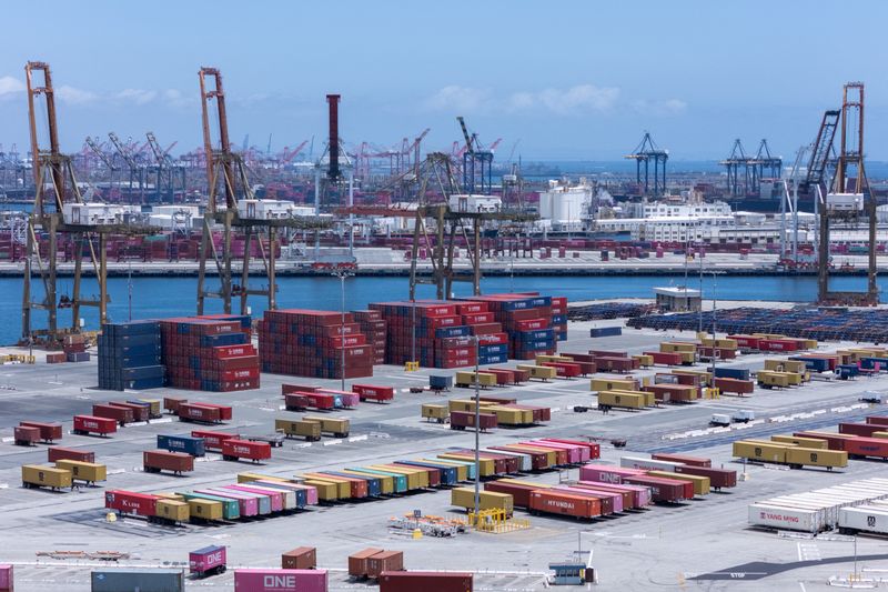 FILE PHOTO: Cranes at the Port of Los Angeles are empty of cargo ships as shown with a drone at in San Pedro California, U.S., May 13, 2025. REUTERS/Mike Blake/File Photo