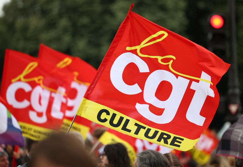 FILE PHOTO: Protesters hold CGT Culture labour union flags during a demonstration against pension reform in Paris as part of a mobilisation for pensions, employment and wages within France June 5, 2025.  REUTERS/Abdul Saboor/File Photo