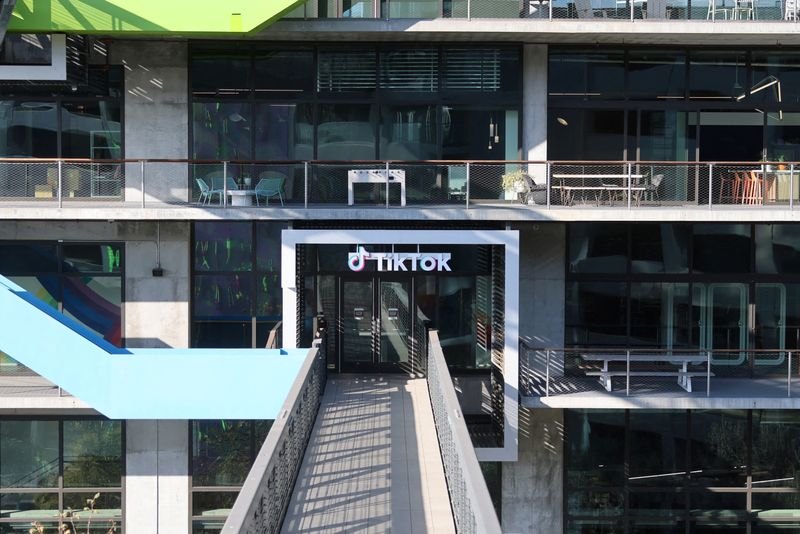 FILE PHOTO: A logo is displayed over a door at the U.S. headquarters of the social media company TikTok in Culver City, California, U.S. January 17, 2025.  REUTERS/David Swanson/File Photo