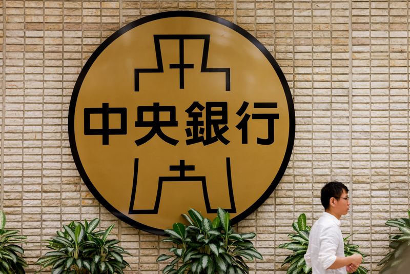 FILE PHOTO: A man stands inside Taiwan's central bank in Taipei, Taiwan May 29, 2025. REUTERS/Ann Wang/File Photo