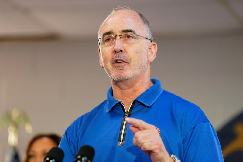 FILE PHOTO: United Auto Workers (UAW) President Shawn Fain speaks during a campaign event at the United Auto Workers (UAW) Local 900 in Wayne, Michigan, U.S., August 8, 2024. REUTERS/Elizabeth Frantz/File Photo