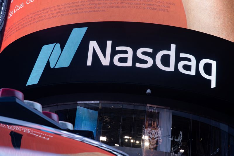 FILE PHOTO: The Nasdaq logo is displayed at the Nasdaq Market site in Times Square in New York City, U.S., December 3, 2021. REUTERS/Jeenah Moon/File Photo